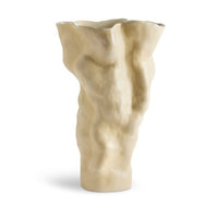 The Timna Vase Latte - Tall by L'Objet features a sculptural, abstract shape with a wavy texture and matte beige finish, inspired by ancient porcelain from the Arava desert. This ceramic vase stands upright for a striking display.