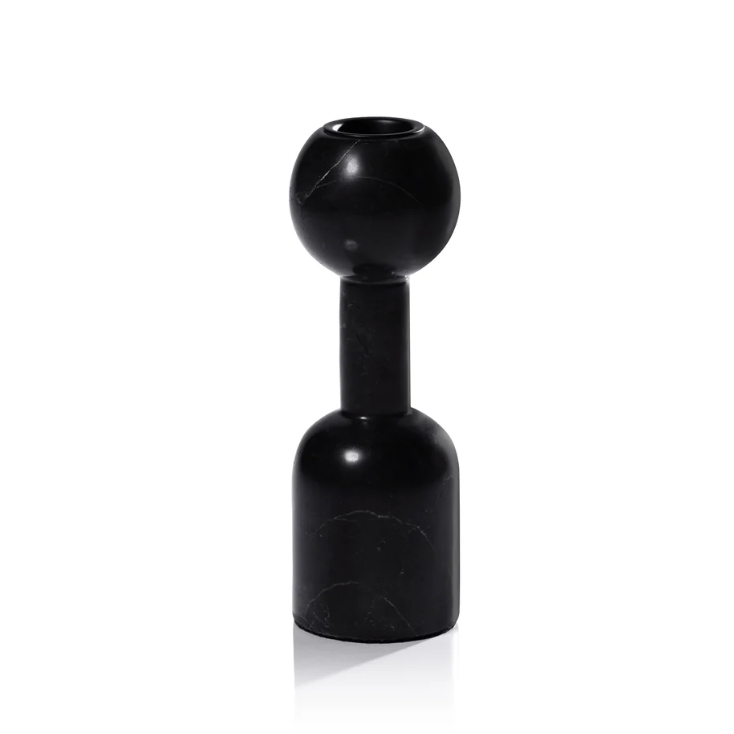The Kym Black Candle Holders by Zodax feature a modern design with a round top, cylindrical neck, and wide cylindrical base in black marble, resembling geometric vases and displayed upright against a white background.