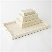 The Global Views/Surya Searchlight Tray Ivory features three handcrafted resin storage boxes in an elegant ivory finish, stacked by size on a matching decorative tray, beautifully displayed against a plain white background.