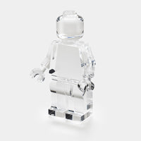 The Luho Brix Sculpture features a clear Lego-style minifigure on a white background, offering a whimsical home accent and unique clear acrylic decor piece.
