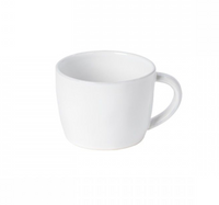 The Livia Dinnerware White coffee cup by Casafina/Costa Nova features a plain white ceramic design with a handle, shown against a white background as part of the modern collection.