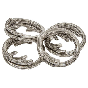 The Tara Napkin Ring Set of 4 by Blue Pheasant features intertwined silver rings with a branch-like texture, adding sophisticated style to any elegant dining table.
