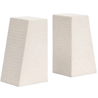Two beige, trapezoidal Rene Faux Shagreen Bookends by Made Goods stand side by side, their subtle hexagonal texture and architectural edges highlighted against a white background.