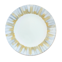 The Marie Daage Panache plate by Marie Daâge is a luxury hand-painted porcelain dinnerware piece with a round white form and alternating gold and silver brushstroke borders radiating from the rim to the center.