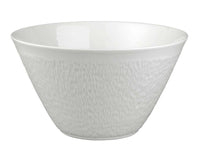 The Raynaud Mineral Dinnerware Glazed White bowl features white Limoges porcelain with a subtle textured exterior, wide opening, and a tapered base, shown against a plain white background.
