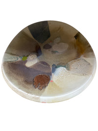 The KleinReid Rio Abrico Platter X Large is a round, hand-painted ceramic piece from the Rio Collection, showcasing an abstract multicolored glaze in earthy browns, beige, gray, blue, and green on white—a unique find for ceramic lovers.