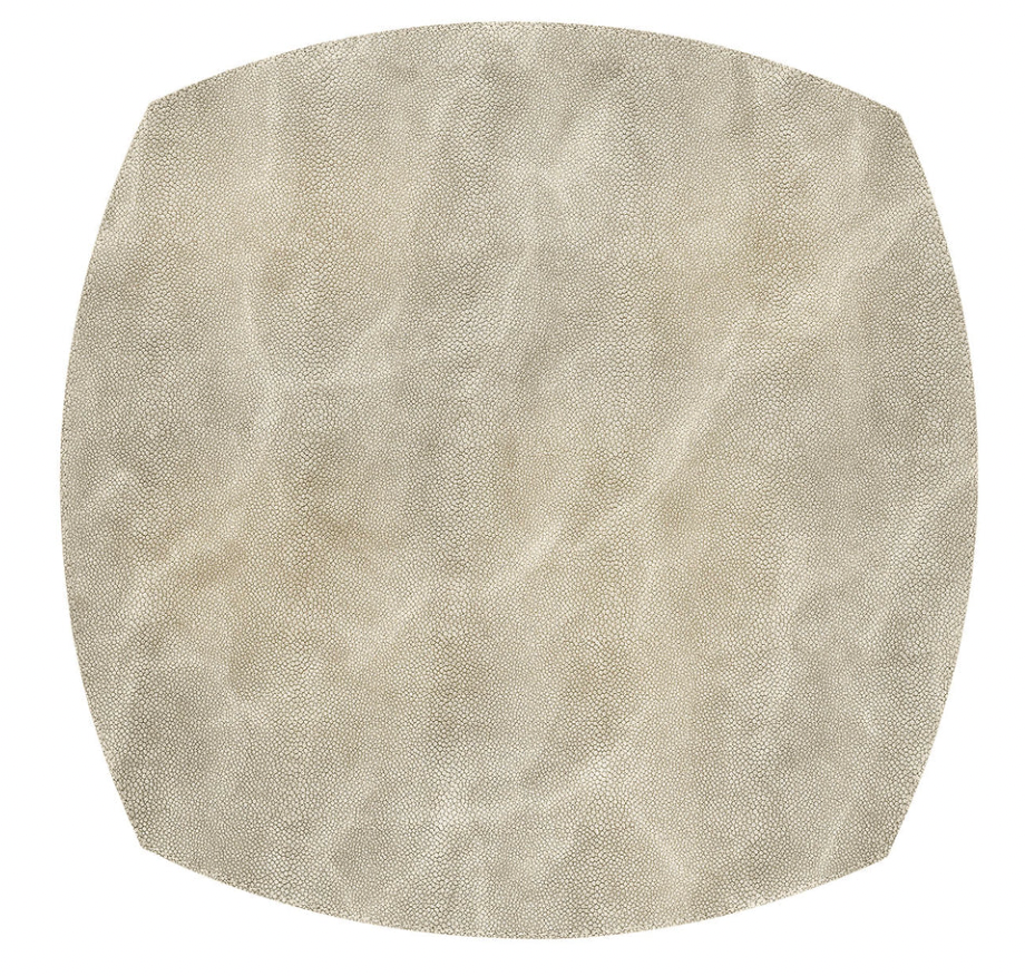 A set of four Bodrum Stingray Elliptic Square Placemats in beige, crafted from phthalate-free vinyl with a soft leather-like textured surface—ideal for modern table settings.