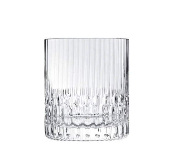 The Apollo Barware by Saint-Louis/Hermes is a clear glass tumbler featuring Venetian stripes and a textured base, displayed against a plain white background.