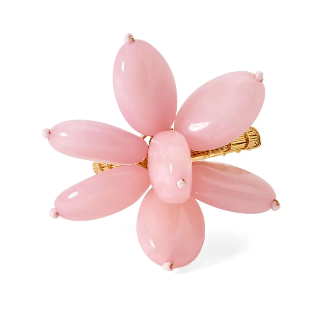 The Mod Stone Flower Napkin Ring Set of 4 by Deborah Rhodes features a glossy gold flower design with six oval pink petals and a round pink center, echoing the brand's modern beaded ring aesthetic.