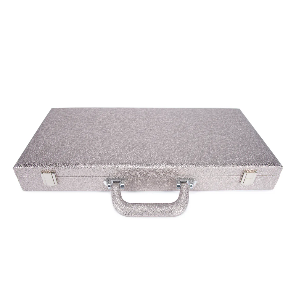 The Brouk & Co Onyx Scrabble Set comes in a closed, rectangular silver briefcase with a textured surface, two metal latches, and a sturdy handle, showcased on a white background.