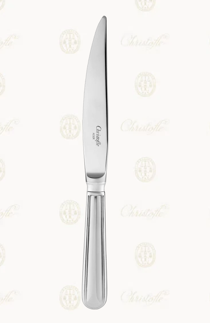 A stainless steel Albi Acier Stainless Steel Serving Utensils dinner knife featuring a serrated blade and a handle with vertical grooves.