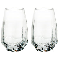 The Vista Alegre Gemstone Highball Set of 2 features clear, geometric tumblers with angled sides and a sturdy base, shown side by side on a white background. These modern glasses are dishwasher safe for easy cleaning.