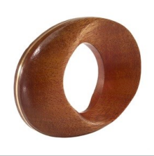The Bodrum Morgan Wood Napkin Ring Set of 4 features smooth, polished natural wood rings shaped in thick ovals with large central holes, elegantly displayed upright against a white background.