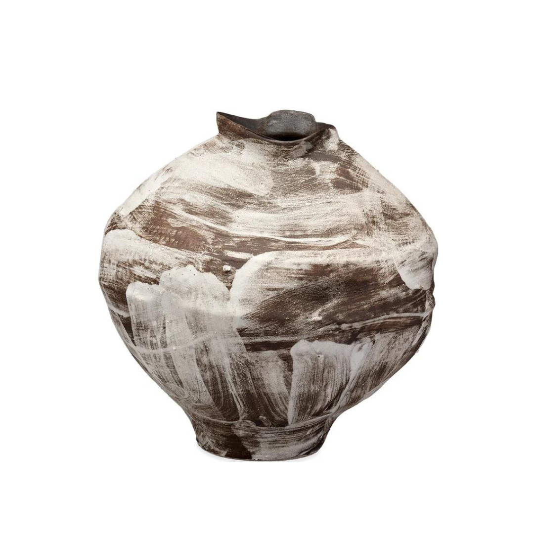 The Moritz Vase - Brown by Jamie Young is a round, brown handcrafted ceramic vase featuring a small uneven opening and abstract white brushstroke patterns across its surface, artfully merging modern neutral tones with a touch of Italian antique style.