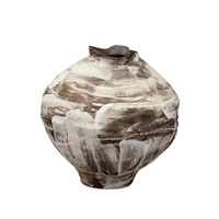 The Moritz Vase - Brown by Jamie Young is a round, brown handcrafted ceramic vase featuring a small uneven opening and abstract white brushstroke patterns across its surface, artfully merging modern neutral tones with a touch of Italian antique style.