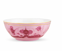 The Oriente Italiano Porpora bowl by Ginori 1735 features a pink exterior with chinoiserie floral patterns and a fine gold rim, capturing the elegance of Italian porcelain against a white background.