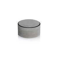 The Aldo Suede Box Grey by Zodax is a round, light gray suede leather storage box with a matching lid and subtle black trim, offering minimalist elegance.