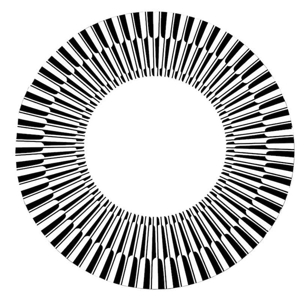 The Manhattan Lacquer Placemat Set of 4 by Von Gern Home features a bold circular design with piano key–like black and white segments radiating around a white center—perfect for adding modern style to your table.