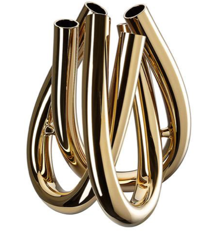 The Trui Vase by Rosenthal features five smooth, curved tubular forms that loop and intertwine, finished with a lustrous PVD coating for a modern, reflective look reminiscent of abstract gold sculpture.
