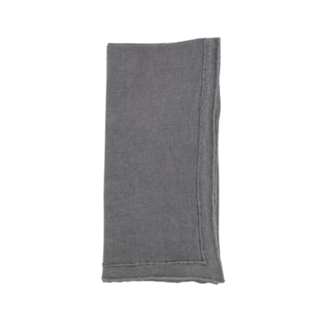 A neatly folded, rectangular gray Overlock Stonewash Border Napkin by Saro Trading with visible stitched edges is shown on a white background.