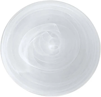 A top-down view of white cream swirled in concentric patterns on a Swirl Alabaster Dinnerware White plate from Mariposa, part of their Set of 4.