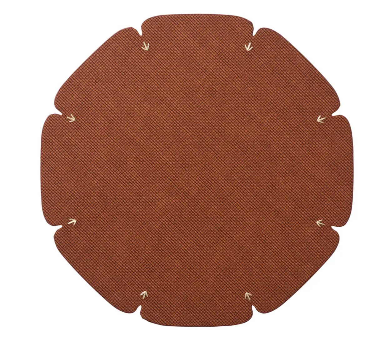 The Divot Placemat Set of 4 by Kim Seybert features flat, brown, textured circular mats with six curved edges and tan stitches near each curve, shown arranged on a white background.