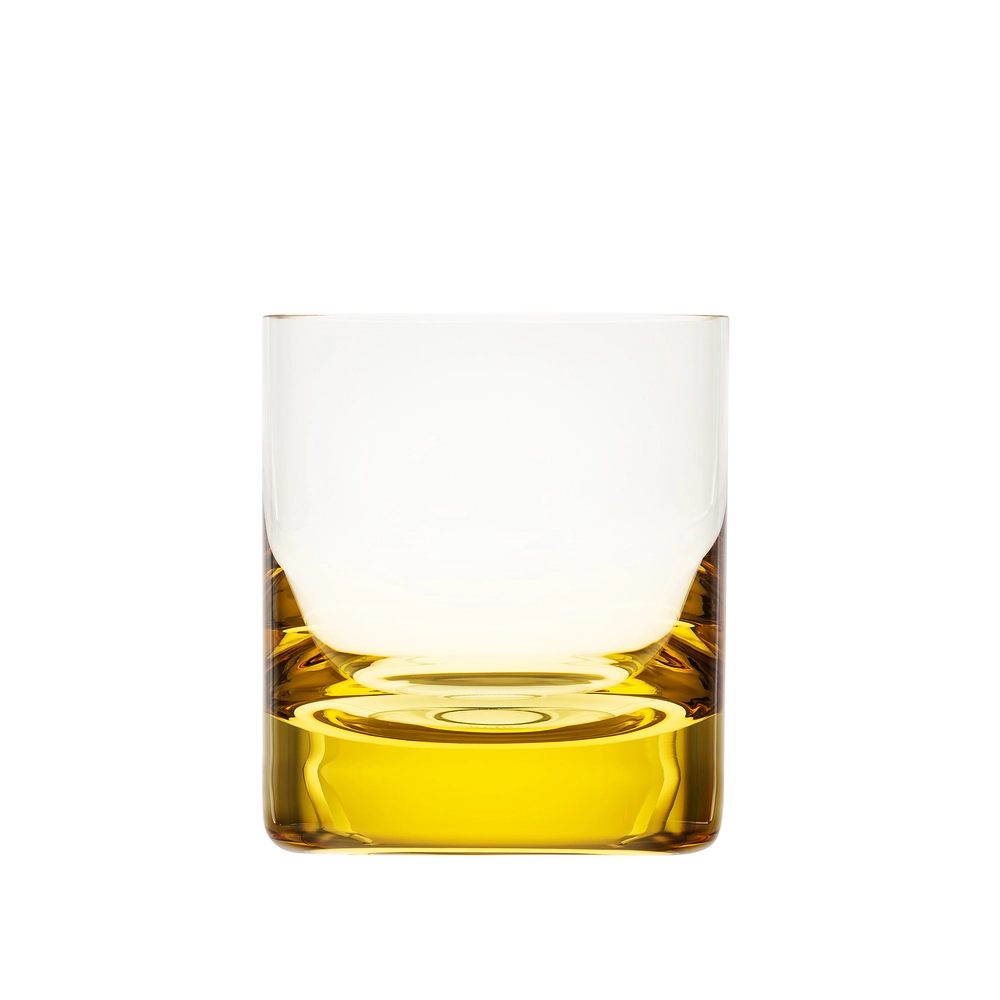 A Moser Whiskey Set DOF Glass 370 ml tumbler, crafted from lead-free crystal, is filled with a golden yellow liquid and photographed against a white background.