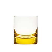 A Moser Whiskey Set DOF Glass 370 ml tumbler, crafted from lead-free crystal, is filled with a golden yellow liquid and photographed against a white background.