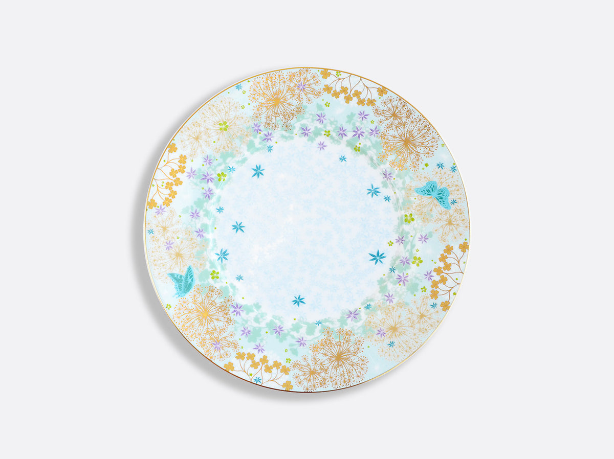 The Fèerie by Michael Cailloux plate from Bernardaud features a delicate floral and gold design with blue butterflies and small blue flowers on white porcelain.