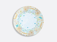 The Fèerie by Michael Cailloux plate from Bernardaud features a delicate floral and gold design with blue butterflies and small blue flowers on white porcelain.