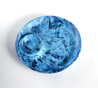 The Nashi Home Swirl Colored Resin Chip & Dip features a blue marbled platter with a central bowl, ideal for serving guests.