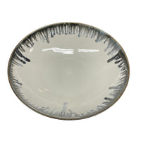 The Michael Wainwright Fjord Serving Bowl - Large features a glossy finish, white interior, and grayish-black drip rim. Its simple, modern design makes it an elegant choice for elevating any dining experience.