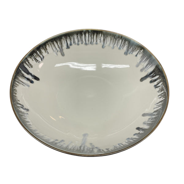 The Michael Wainwright Fjord Serving Bowl - Large features a glossy finish, white interior, and grayish-black drip rim. Its simple, modern design makes it an elegant choice for elevating any dining experience.