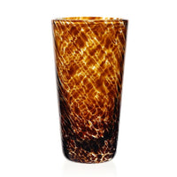 The Vanessa Drinkware Tortoise by William Yeoward is a tall, handcrafted crystal tumbler featuring a marbled tortoiseshell pattern in brown, amber, and black—a striking piece of luxury drinkware.