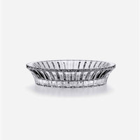 The Baccarat Mille Nuits Wine Coaster is a clear, round crystal dish with vertical ridges, flaring at the rim and narrowing at the base, displayed on a plain white background.