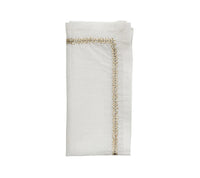 The Kim Seybert Jardin Napkin Set of 4 features elegantly folded table napkins with a decorative gold-embroidered border along two edges, displayed on a plain white background.