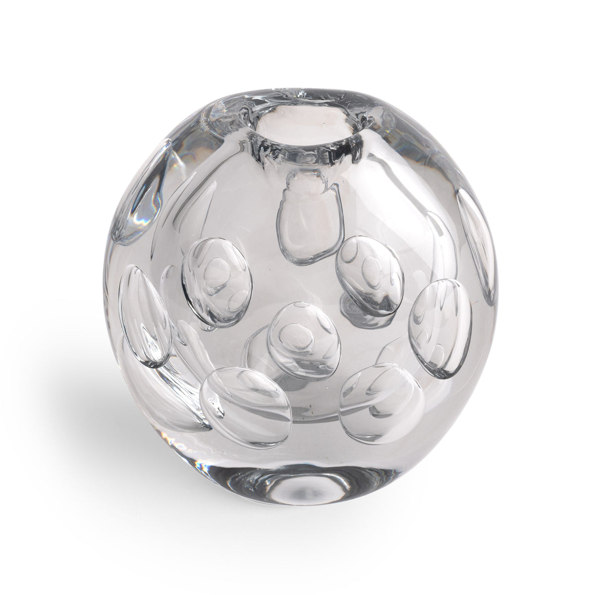 The Whitney Vase by FlowDecor Inc. is crafted from clear glass and features round indents on its surface, creating a contemporary look reminiscent of a decorative paperweight, shown here photographed against a white background.