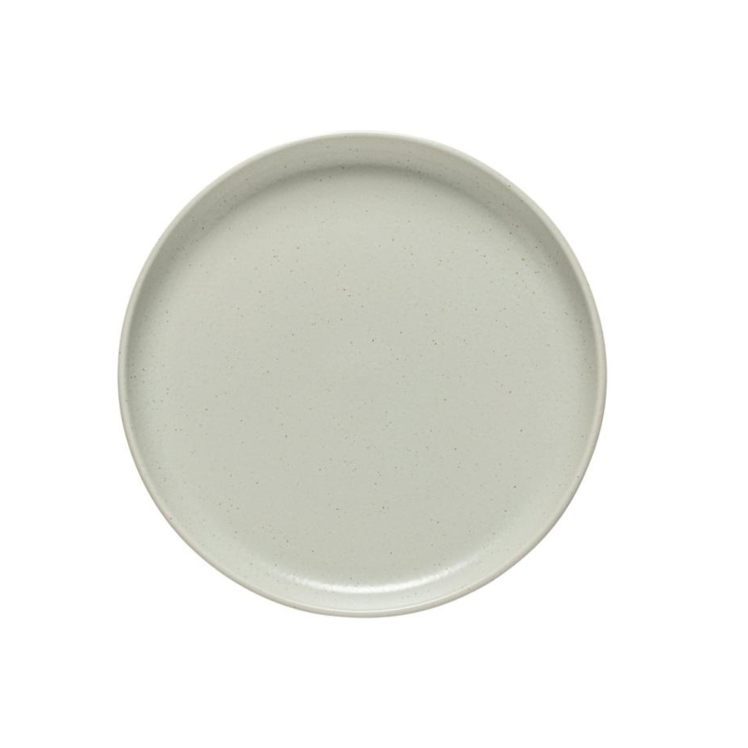 The Costa Nova Pacifica Dinnerware Oyster Grey plate features a smooth, slightly matte light gray finish—ideal for elegant table settings. Shown from above against a white background.