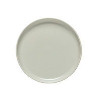The Costa Nova Pacifica Dinnerware Oyster Grey plate features a smooth, slightly matte light gray finish—ideal for elegant table settings. Shown from above against a white background.