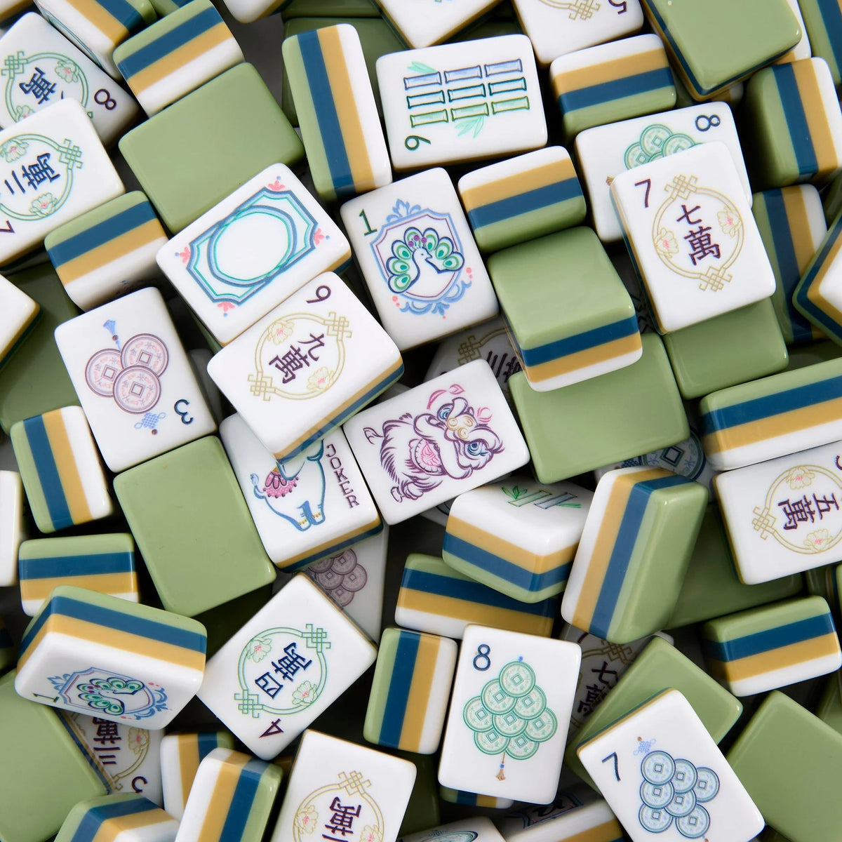 A collection of elegant tiles from the Oh My Mahjong brand’s Mahjong Tiles Set - Willow, featuring various designs, numbers, and Chinese characters in a refined green, white, and yellow color scheme. Some tiles are delicately adorned with subtle floral patterns, adding an extra layer of sophistication to this Willow Mahjong set.