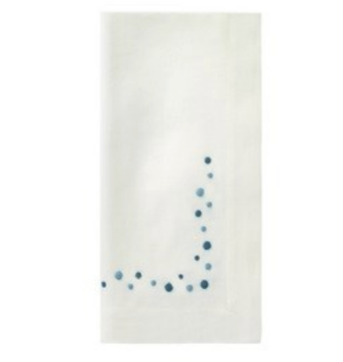 Add charm to your table with Bodrum’s Dots Napkin Set of 4- Blue—white cloth napkins featuring a curved pattern of small blue dots near one corner, perfect for enhancing any white napkin set.