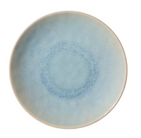 The Merritt Reactive Glaze Melamine Dinnerware Blue features a round plate with a glossy light blue center, a pale blue gradient texture radiating outward, and a thin off-white rim.