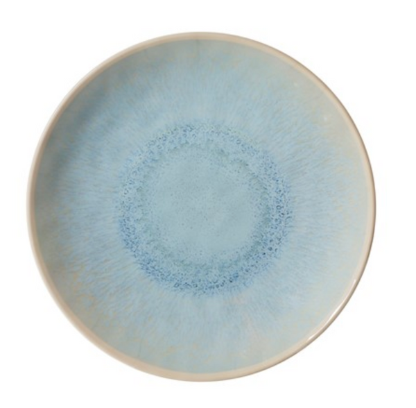 The Merritt Reactive Glaze Melamine Dinnerware Blue features a round plate with a glossy light blue center, a pale blue gradient texture radiating outward, and a thin off-white rim.