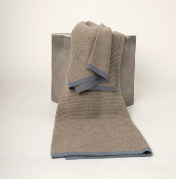 Hangai Mountain Textiles Yak Ribbed Throw - Platinum & Slate in tan with a grey border, draped over a grey cube.