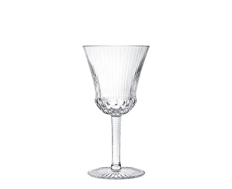 Apollo Stemware by Saint-Louis/Hermes is a clear crystal wine glass featuring vertical ribbed patterns on the bowl, a textured stem, and a round patterned base, shown upright against a plain white background.