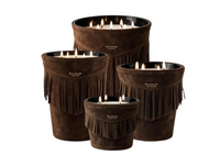 Four brown fringed Baobab Calamity Jane Candle - Deadwood candles in graduated sizes, each with multiple lit wicks.
