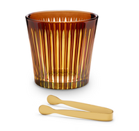 The Prism Ice Bucket w/ Tongs by L'Objet features faceted amber glass with vertical gold accents, paired with matte gold metal tongs, displayed on a white background.