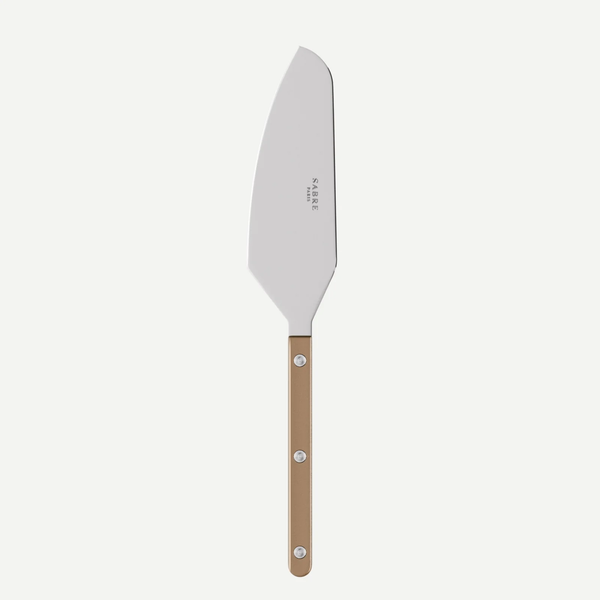 The Sabre Bistrot Pearly Tart Slicer features a broad, angled stainless steel blade and a light brown customizable handle secured by three metal rivets, shown against a white background.