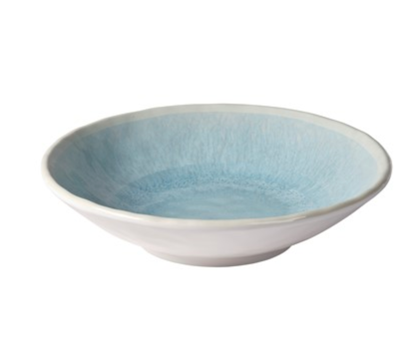 The Merritt Reactive Glaze Melamine Dinnerware Blue features a shallow, round bowl with a white exterior and light blue, textured interior that showcases an artisanal stoneware look in durable melamine.