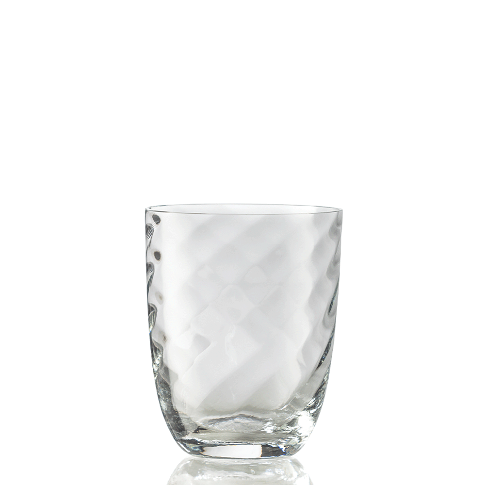 The Idra Tumbler Optic Twist by Nason Moretti is a clear glass with a textured, diamond-patterned surface, shown against a white background.